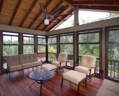 tigerwood-floor-in-sunroom A craftsman styled sunroom with a large fan sits over tigerwood flooring.