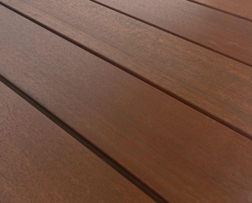 torem-black-walnut-exoshield-deck-boards A close-up of torem 5/4x4 decking showing the tight interlocked grain.